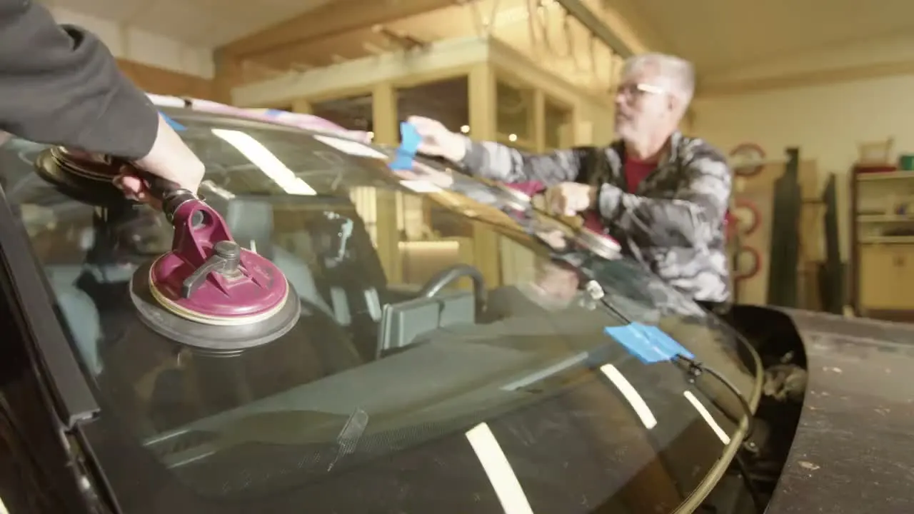 Technicians setting a windshield